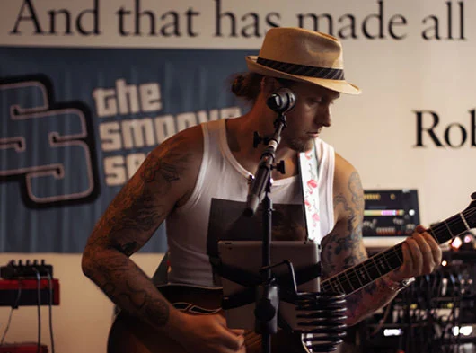 Close up of Mike Angeli from Smoove Series playing guitar at Two Roads Brewing in Stratford, CT