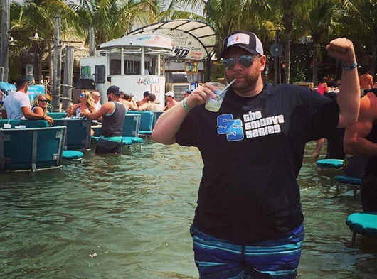 Joe Saad of Smoove Series party in the water wearing Smoove Series vintage tshirt