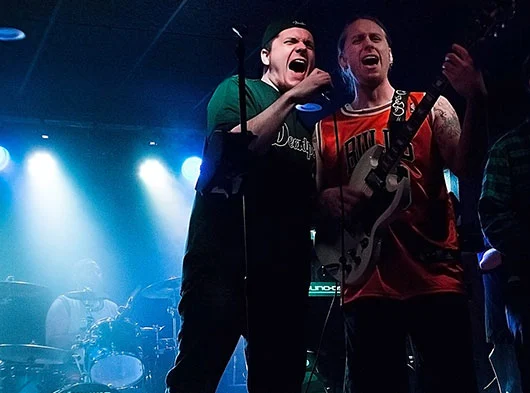 Mike Angeli & Joe Scovill singing into one mic together at Bleacher's Bar in Bristol, CT